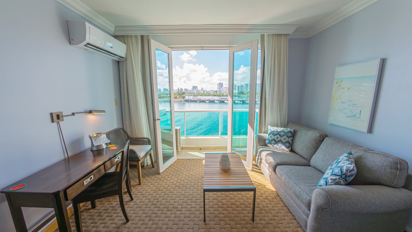 Pelican Suite living area with balcony doors open to the lagoon